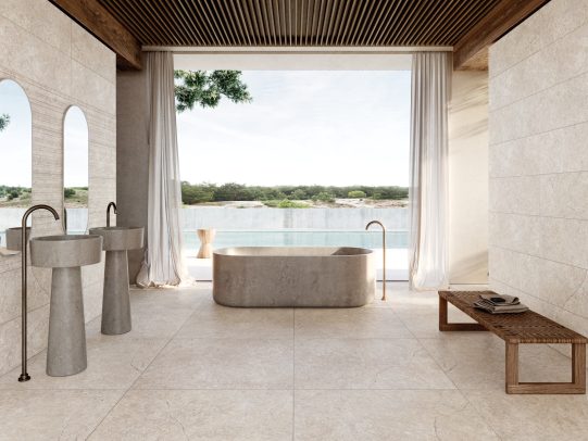 Baños de lujo Baño moderno con paredes de mármol, bañera negra y lavabo de piedra. Suelo de mármol.